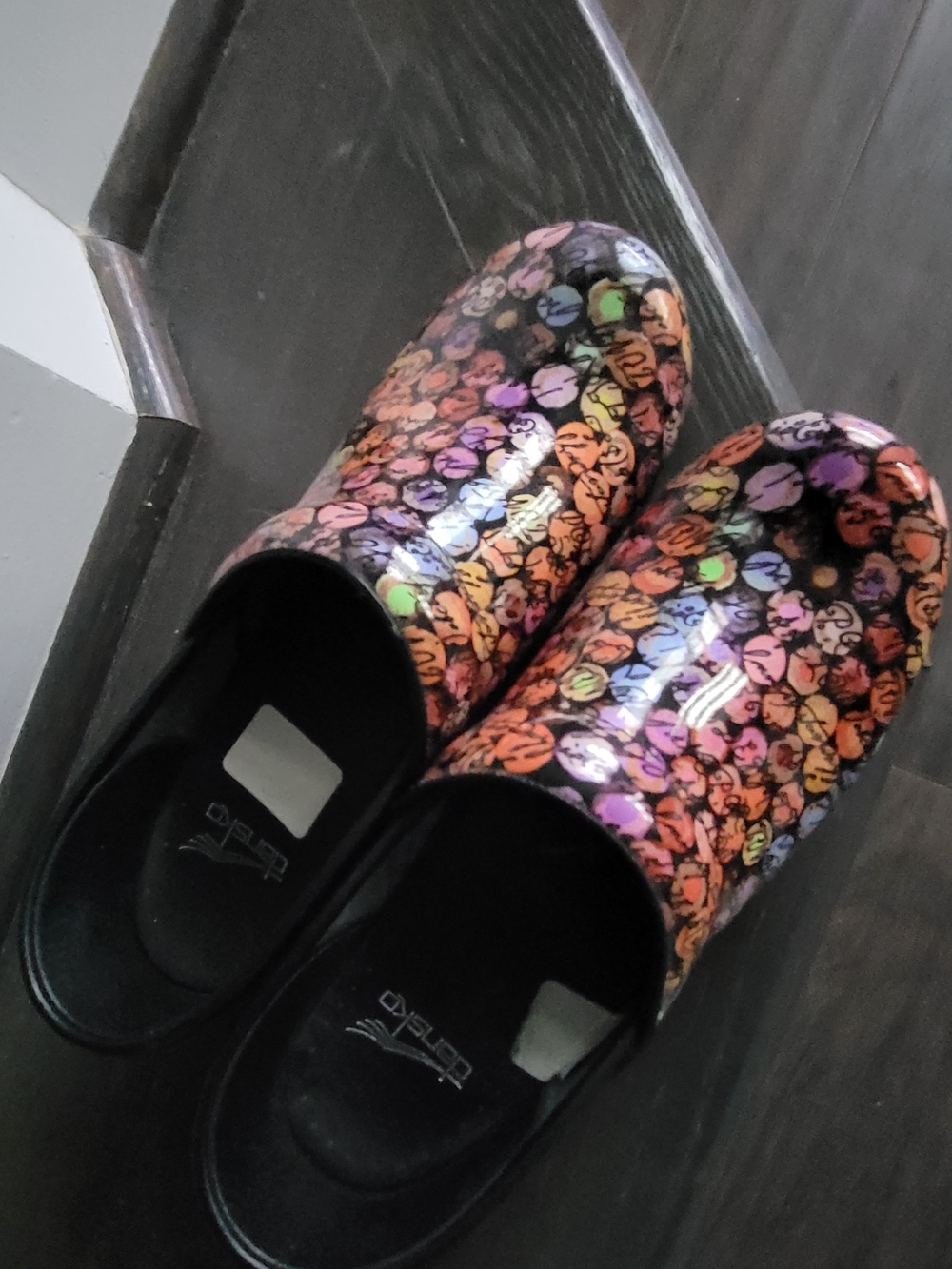 Dansko Black Clogs with Multicolor Floral Dots